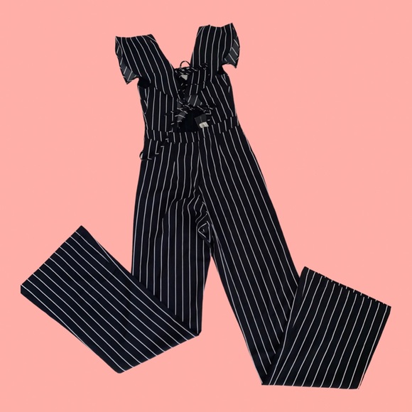 Brand new black with white stripes jumpsuit. - Picture 2 of 2